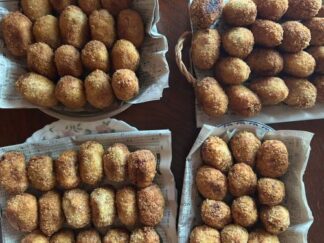 a table full of croquettes