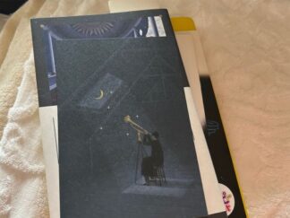 a postcard and books