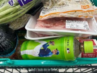 green tea bottle in a shopping cart