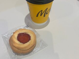 a bisucuit with a cup of coffee