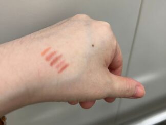 testing lip shades on my palm