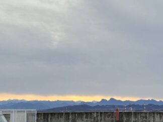 gray sky, sunset over the mountain